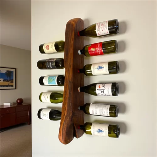 Handcrafted wooden wall-mounted bottle holder with irregular edge for 11 bottles of wine