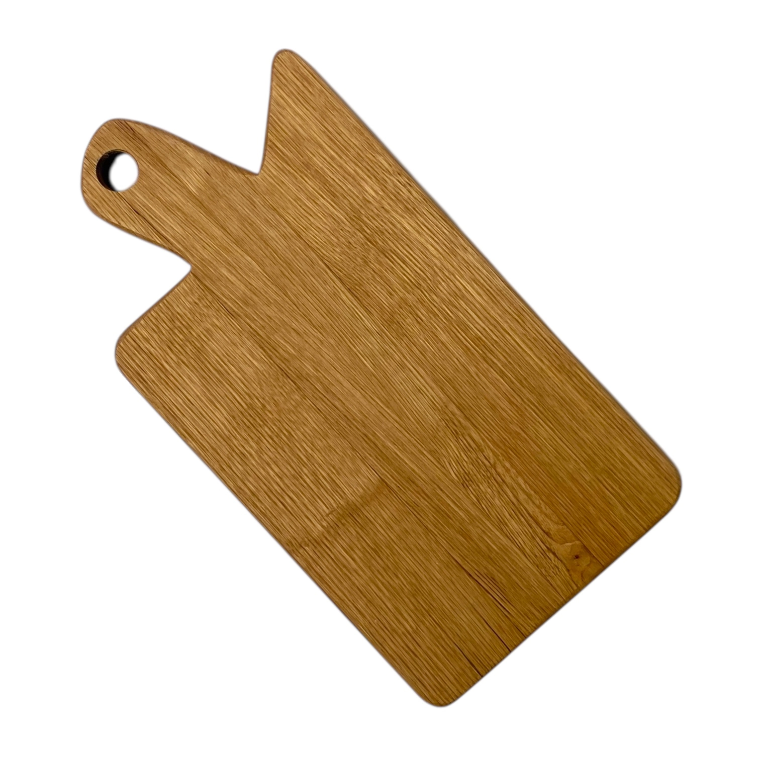 Tagliere artigianale in legno massello di castagno con manico, finitura naturale e venature calde