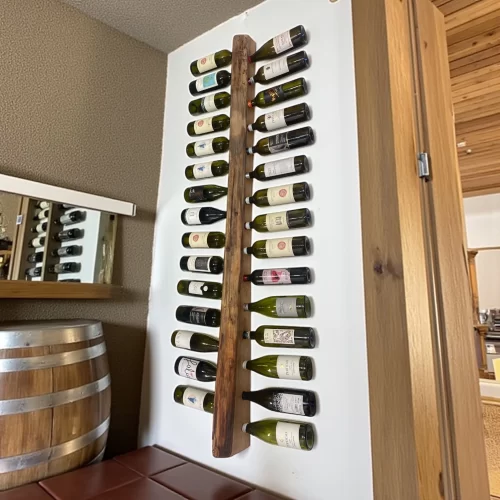 Handcrafted wooden wall-mounted bottle holder with irregular edge for 30 wine bottles