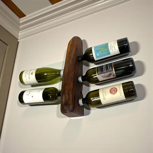 Handcrafted wooden wall-mounted bottle holder with irregular edge for 5 bottles of wine