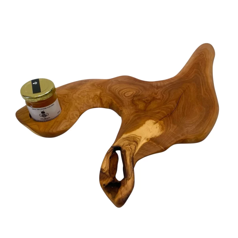Tagliere artigianale in legno di ulivo con un barattolo di miele dell’Umbria su vassoio naturale